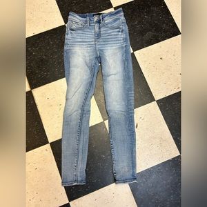 Buckle black skinny jeans